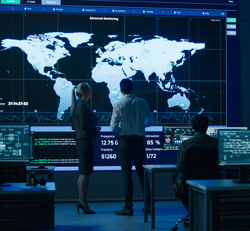 Mission control center with world map wall display